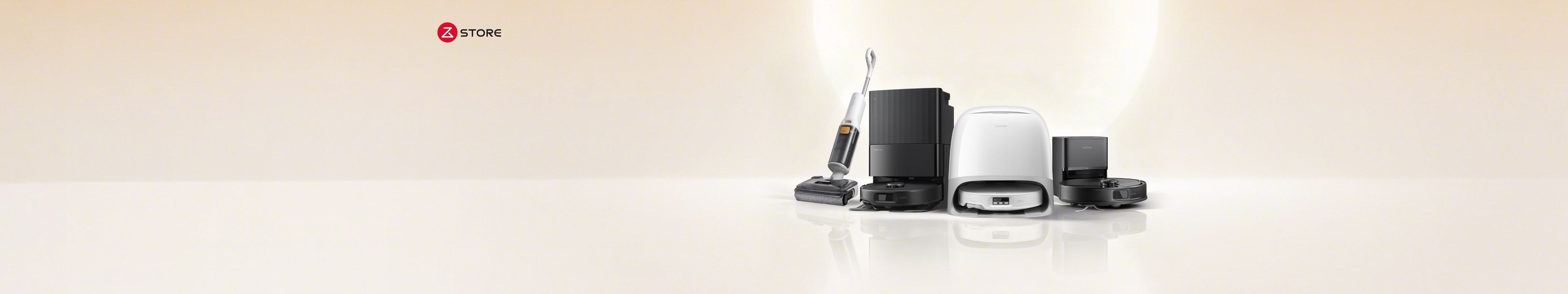 Lineup of four Roborock cleaning devices side by side, a white wet/dry vacuum standing upright, a black robot vacuum docked in a base station, a white robot vacuum docked in a base station, and a black robot vacuum docked in a base station