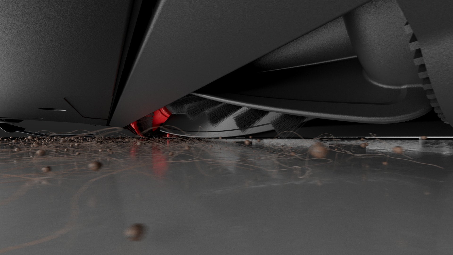 Low-angle view of Saros 10 vacuuming debris and hair from the floor.