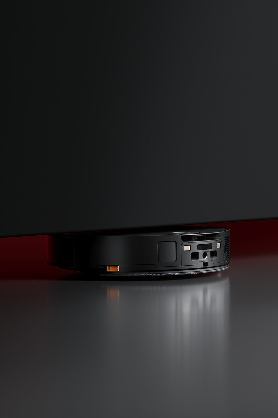 Saros 10 moving under low furniture with its low-profile body.