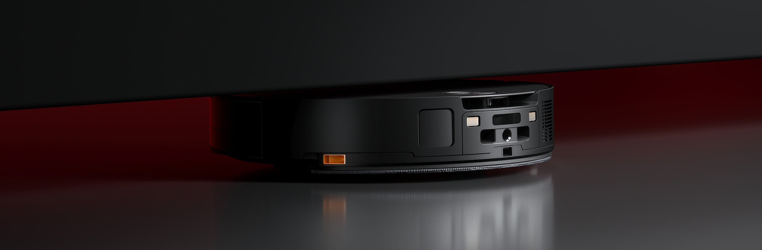 Saros 10 moving under low furniture with its low-profile body.